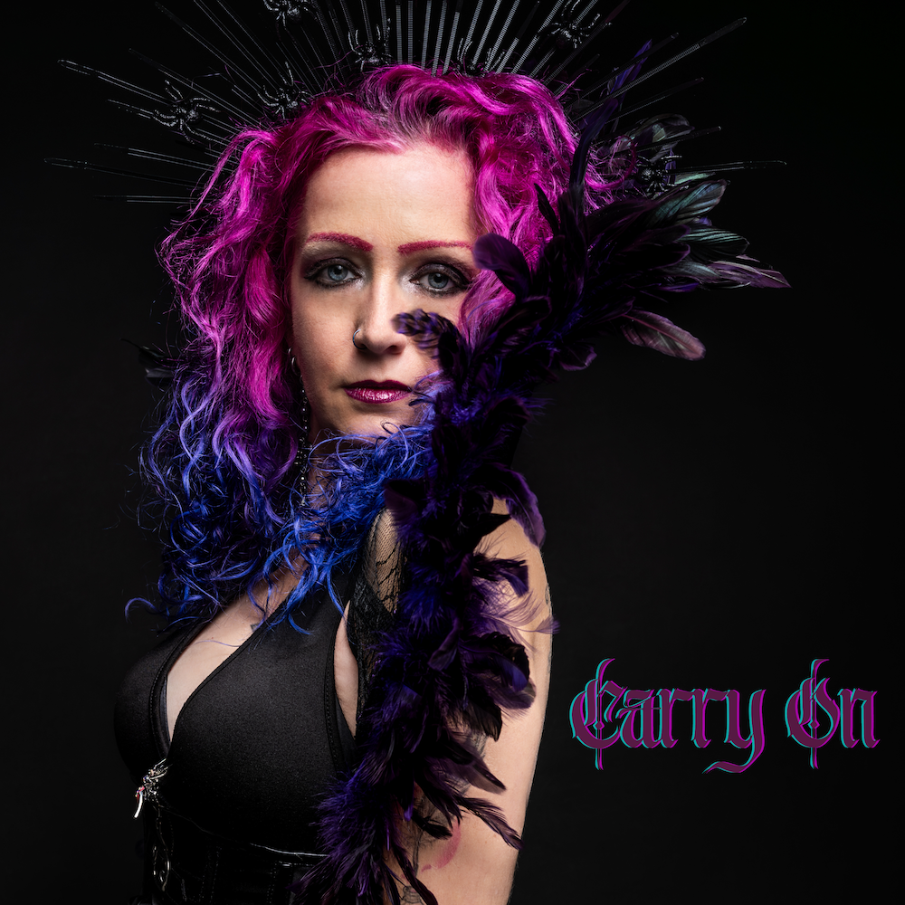 The 10th single from ‘The Spider Queen’ reminds us to ‘Carry On’